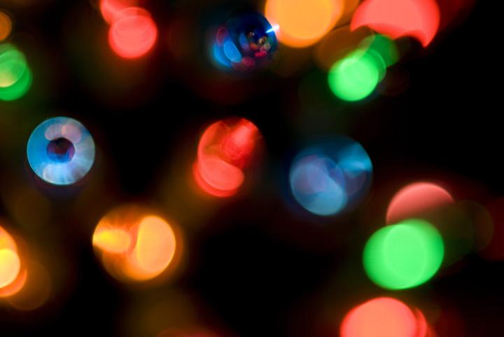blurred abstract details of multicolored christmas mini lights