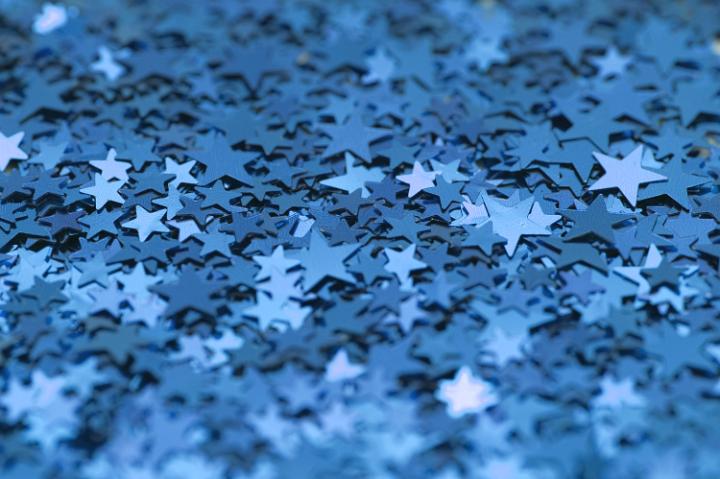 a colorful background of sparkling blue stars