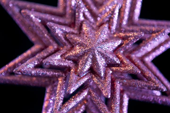 a glittery pink christmas star tree decoration