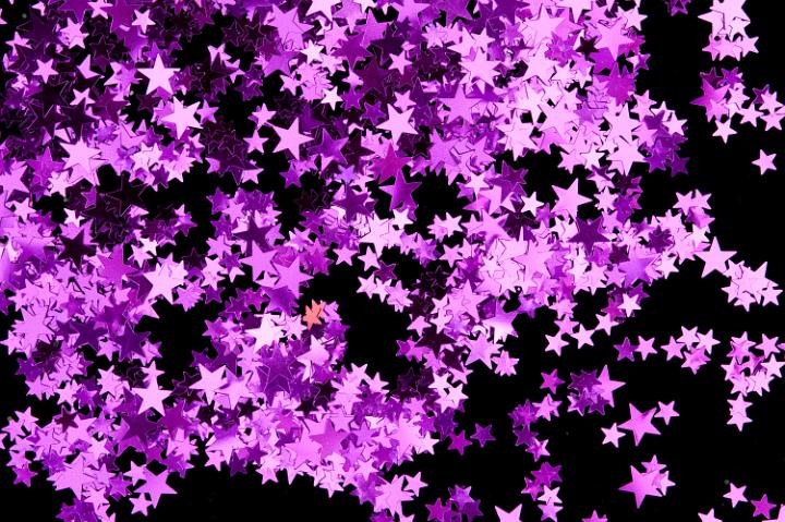 a background of pink five pointed star shapes
