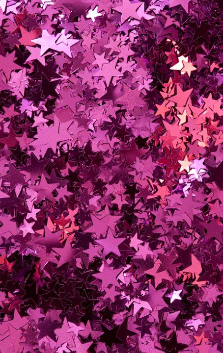 a colorful background of random pink red star shapes