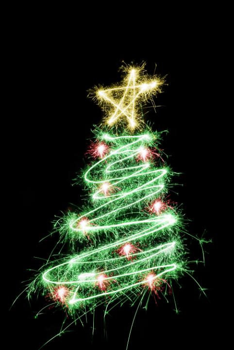 a christmas tree with star on top and red baubles all drawn with sparkler light
