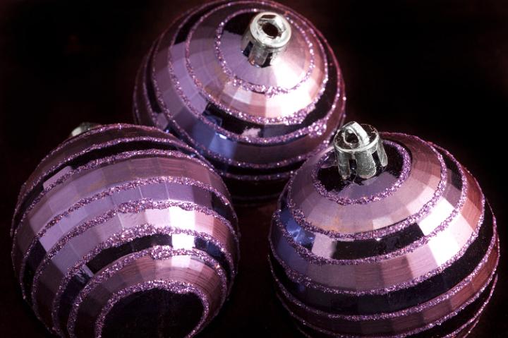 close up on three pink chirstmas baubles