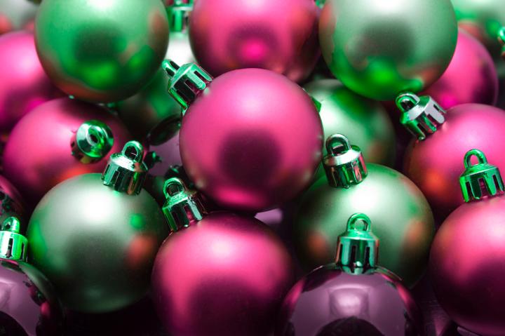 Closeup background of a pile of random red and green Xmas baubles for your Christmas greeting