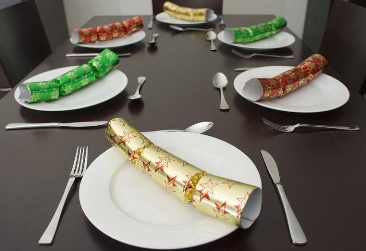 a modern dining table set for christmas dinner