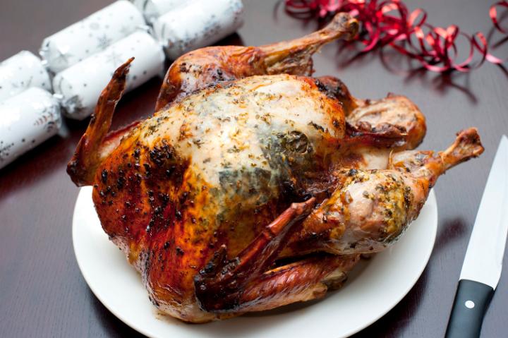 High angle view of a crispy whole roast festive turkey on a plate for Christmas or Thanksgiving celebrations