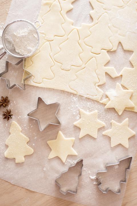 Dough cutters and pastry background preparing for Christmas
