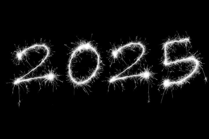 New Years 2025 numerals drawn with bright sparkling lights isolated on black background