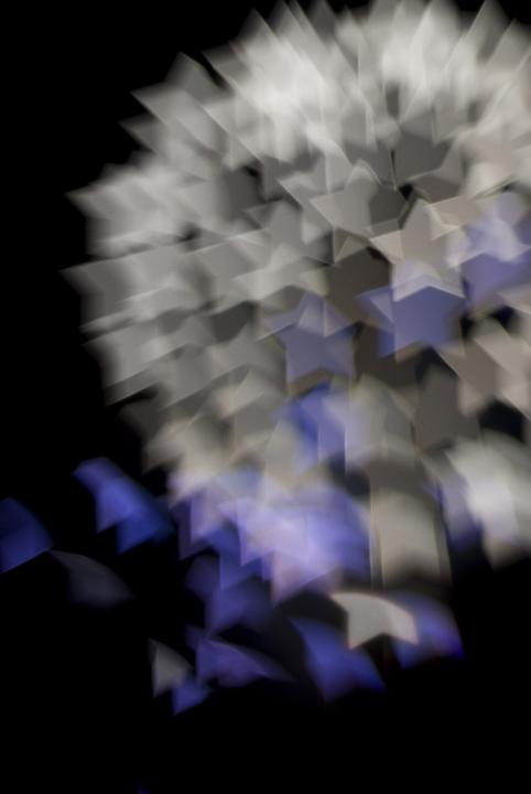 A fire work burst with lens bokeh effect created in camera