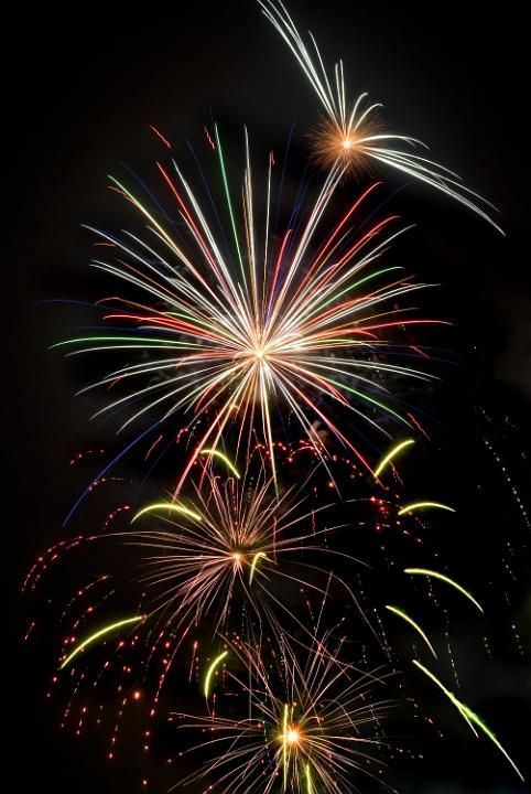 A eve pyrotechnic display to welcome in the new year, rockets light up the night sky