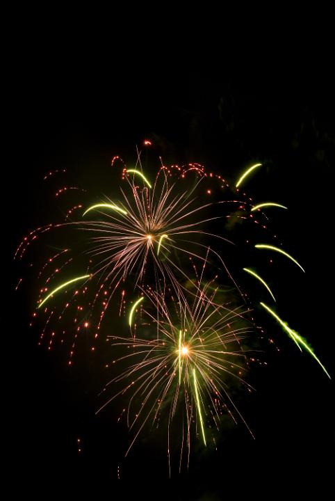 a newyears eve firework display brightens the dark winter sky