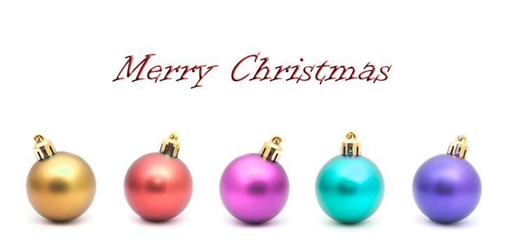 Merry Christmas greeting card with a row of colourful round baubles with shadow detail on a white background