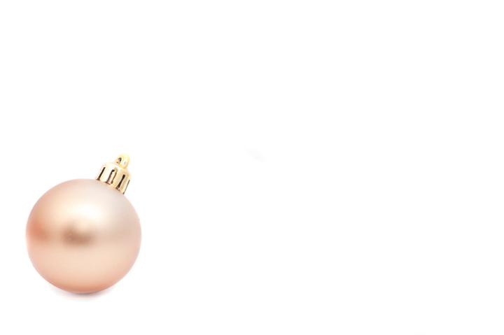 Single gold Christmas bauble with a huge white copy space for your text