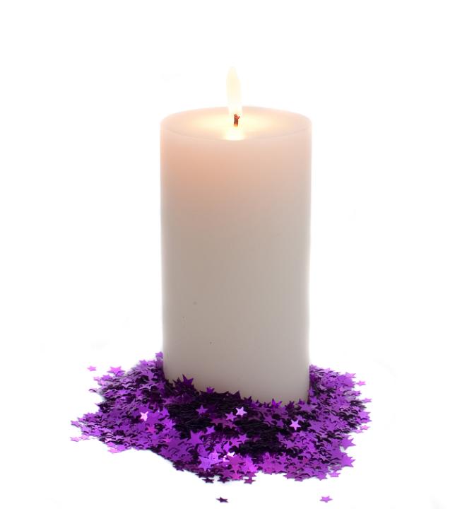 an isolated christmas candle cutout on a white backdrop, surrounded by magenta coloured christmas stars
