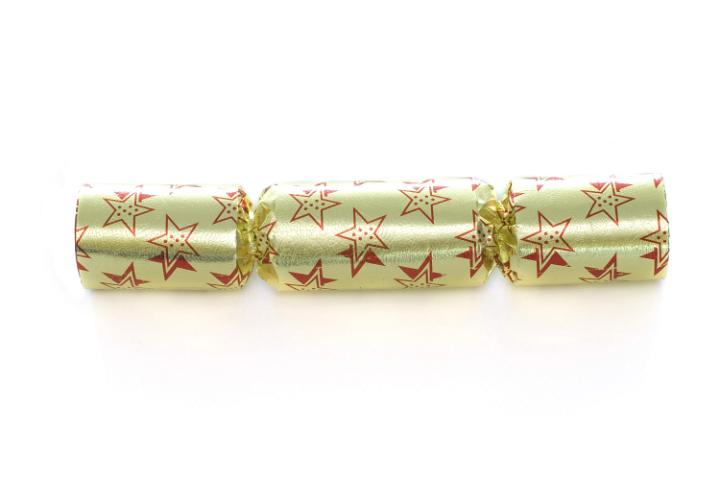 A yellow metallic christmas cracker isolated on a white backdrop