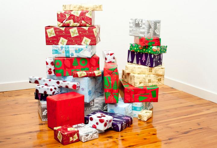 Pile of gift boxes, wrapped in decorative wrapping paper with seasonal patterns, indoors, symbol of joy and giving celebrated at Christmas