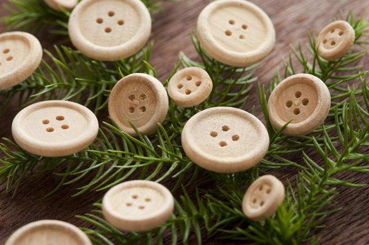 traditional christmas decorations a fir branch with wooden buttons
