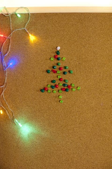 Handmade Christmas tree made of pins, colorful garland