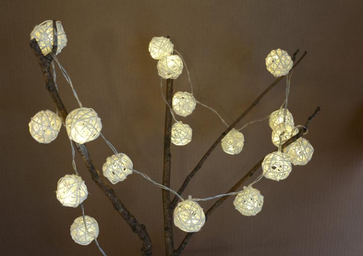 Handmade illumination on tree branch. Shadows