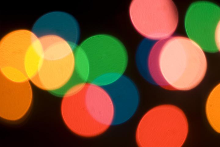 defocused bokeh image of colourful christmas fairy lights