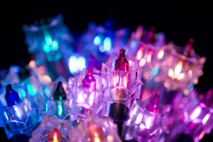 details of blue, purple and pink incandecent christmas fairy lights