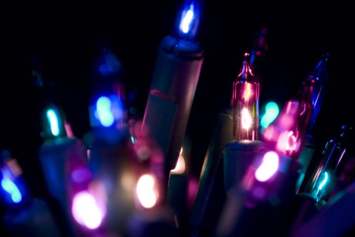 close up on purple and pink coloured christmas fairy lights